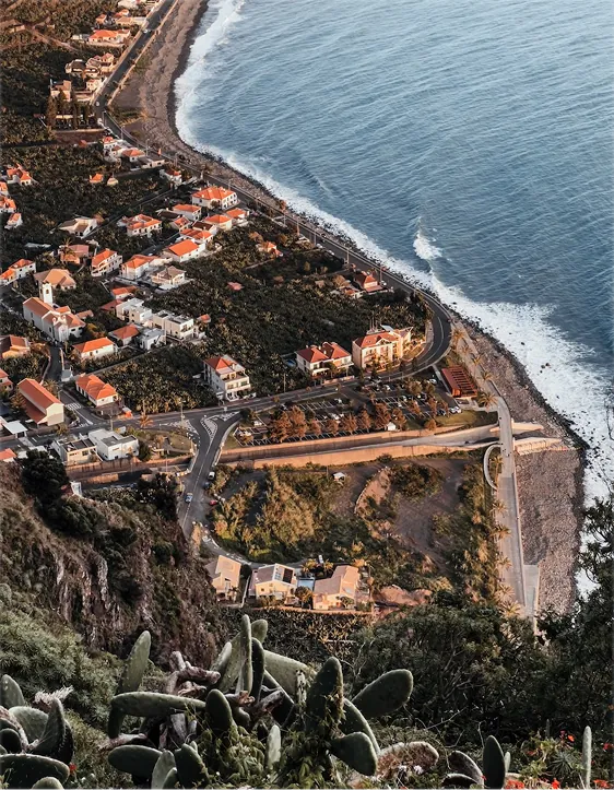 Coastline with cliffs and houses, shot from above