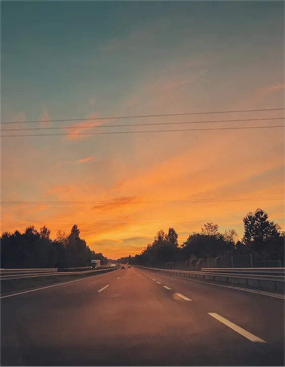 Empty road at sunset