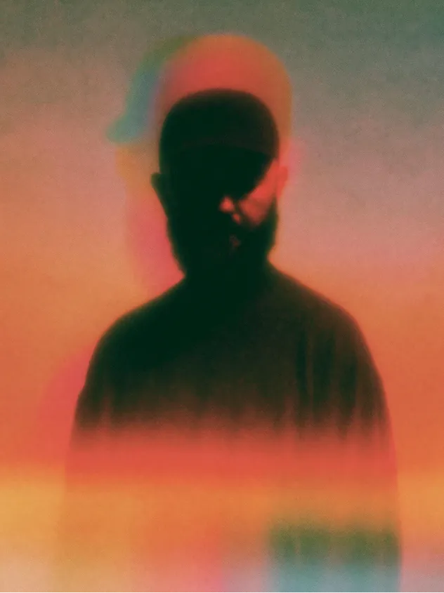AI-generated portrait of a bearded man in warm light